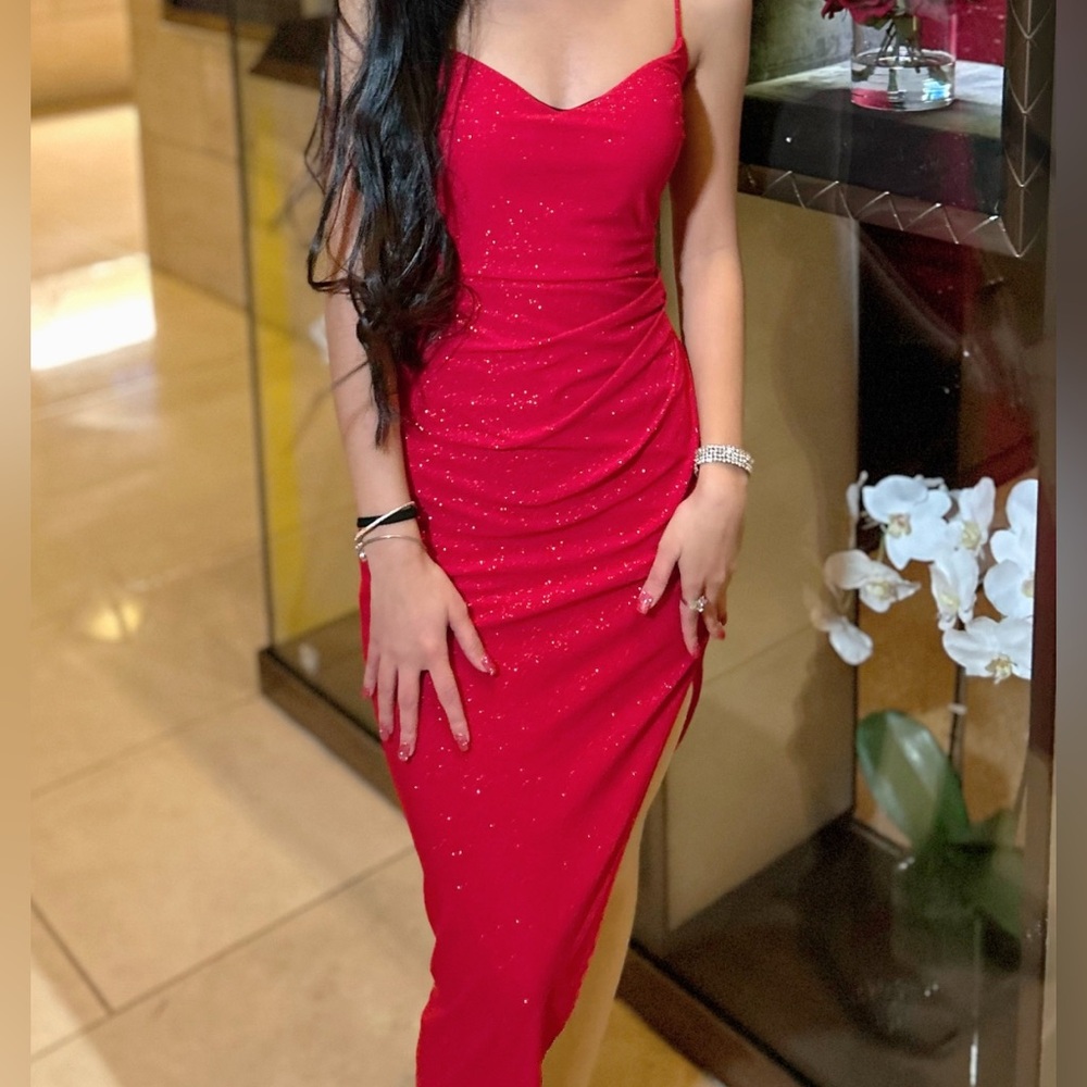 A stunningg sparkle red dress. 
Size: Small
Condition: New